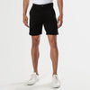 7 Black Comfort Knit Chino Shorts, button-front, worn with white sneakers.