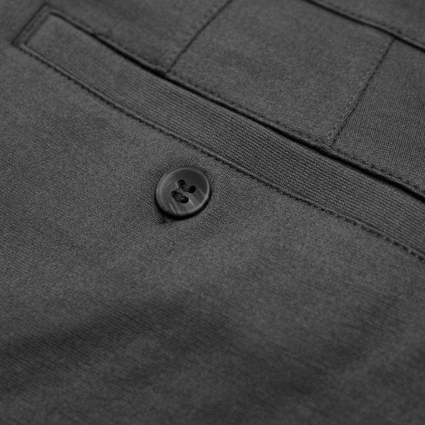 Carbon 7.5 Inseam Chino Shorts, welted pocket, two-hole button detail.