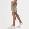 7 Khaki Comfort Knit Chino Shorts styled with white shirt and sneakers.