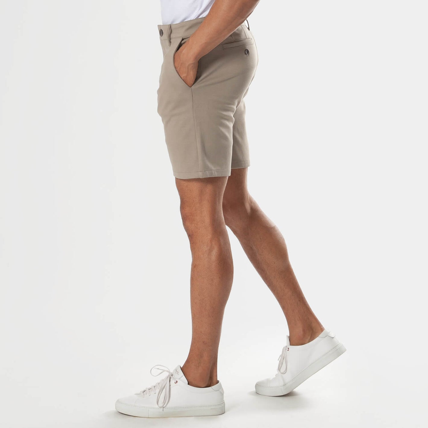 7 Khaki Comfort Knit Chino Shorts styled with white shirt and sneakers.