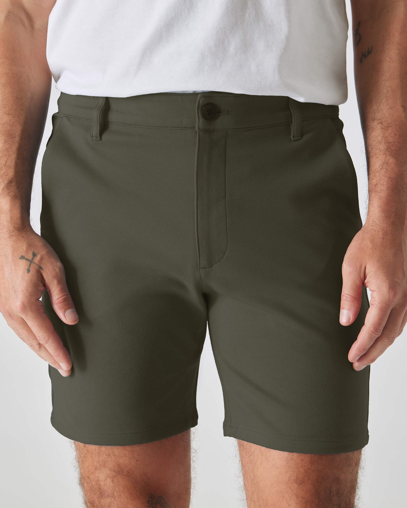 Man wearing 7 Military Green Comfort Knit Chino Short.