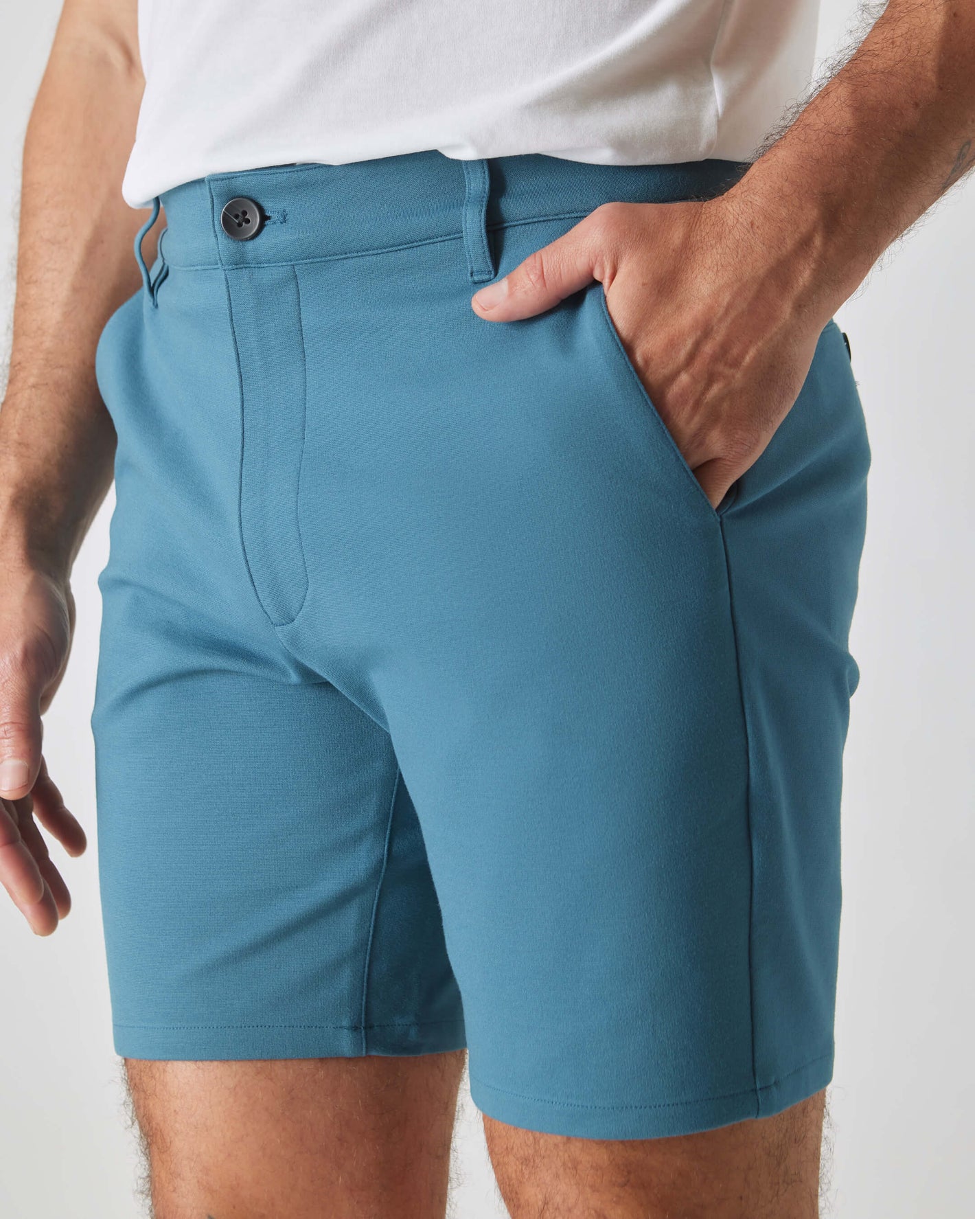 Man wearing 7 Sapphire Comfort Knit Chino Short with side pocket.