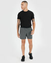 Man wearing 7 Carbon Active Training Shorts 2.0, showcasing athletic fit.