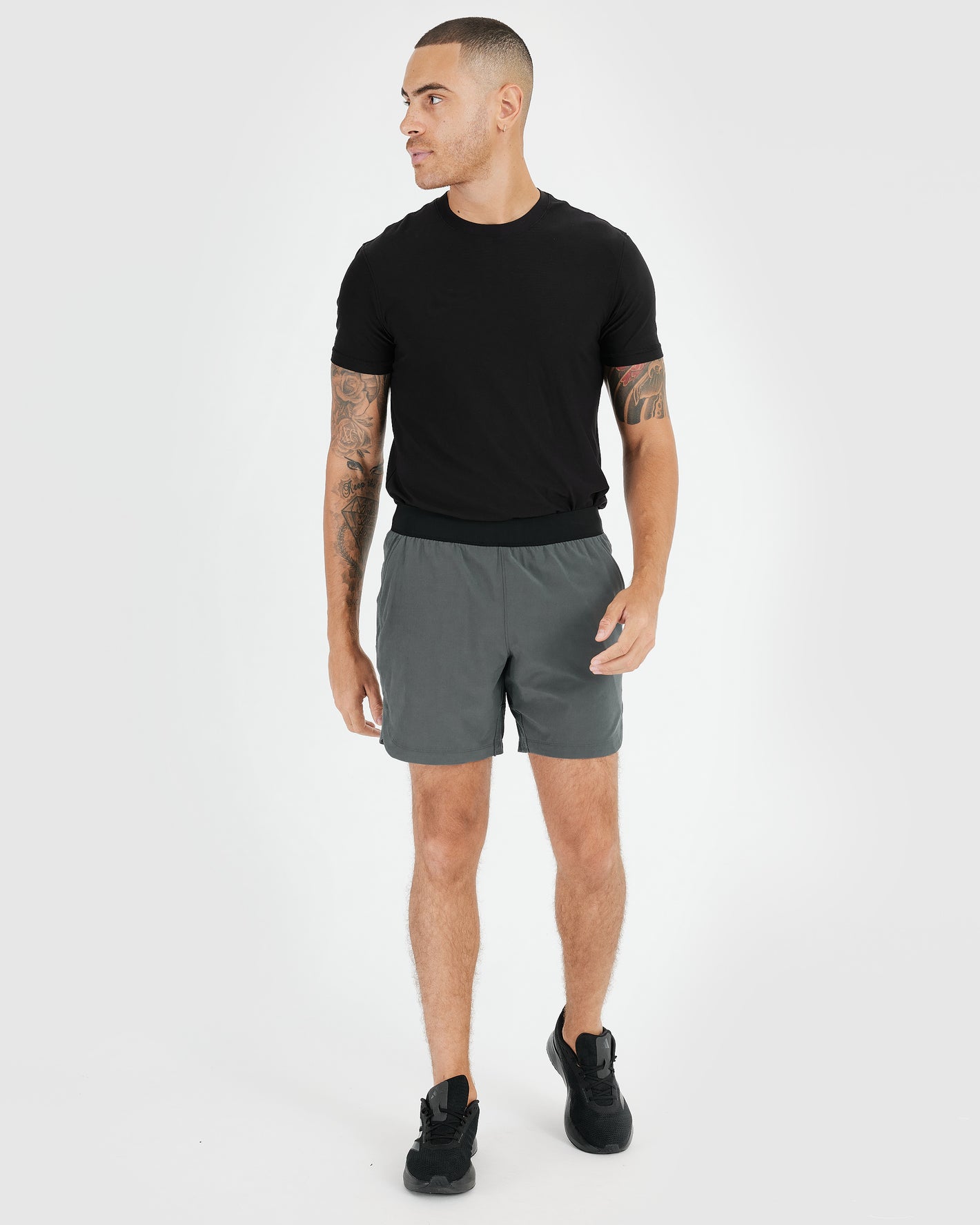 Man wearing 7 Carbon Active Training Shorts 2.0, showcasing athletic fit.