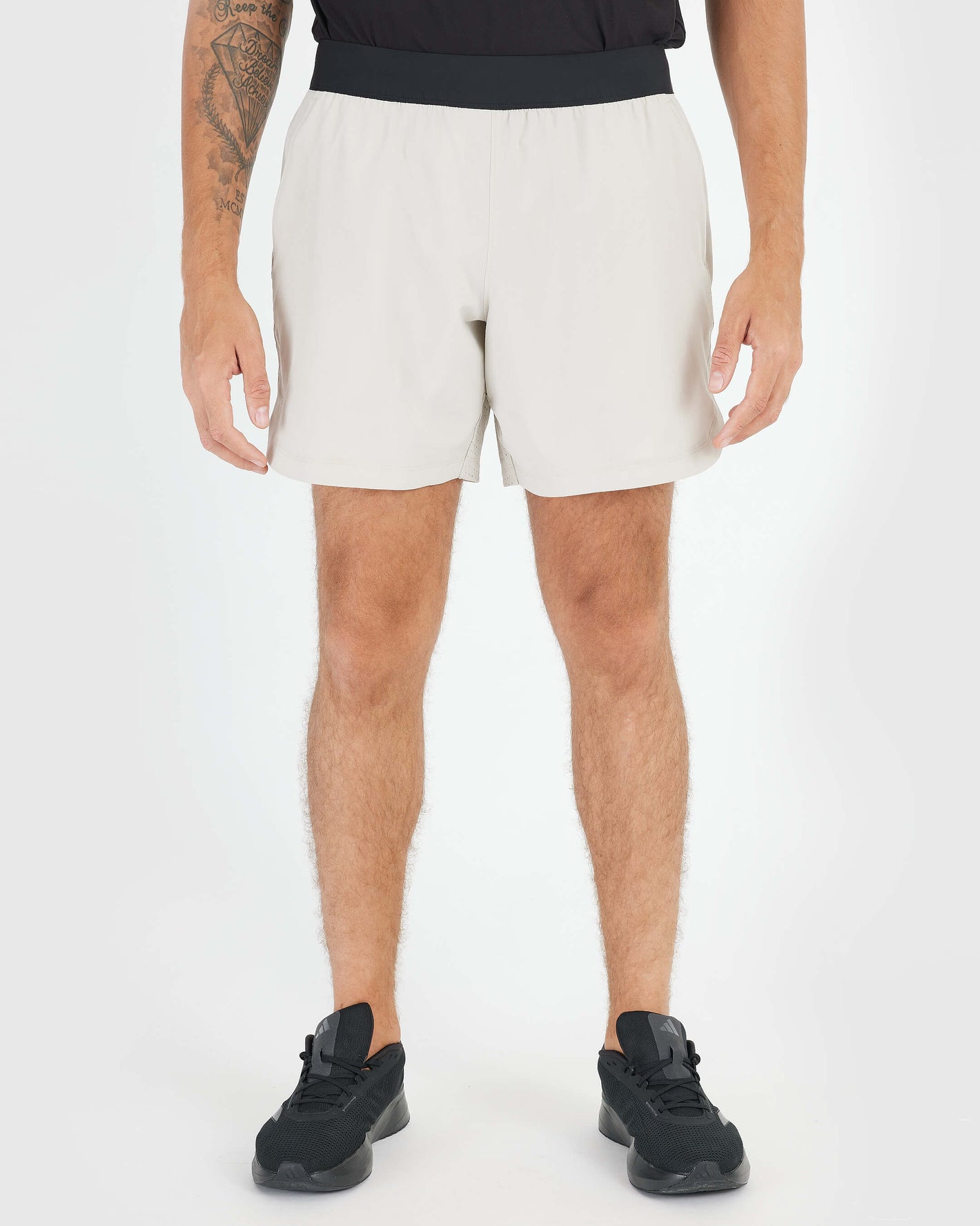 7 Sandstone Active Training Short showcasing breathability and comfort with black waistband.