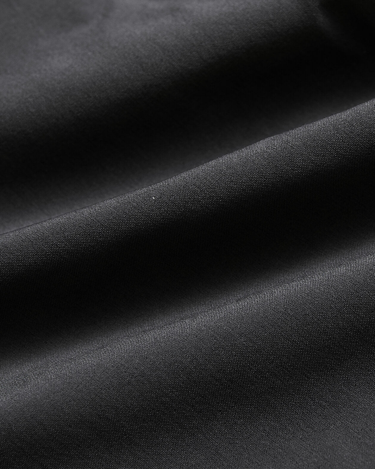 7 Carbon Active Training Short fabric close-up highlighting smooth texture and drape.