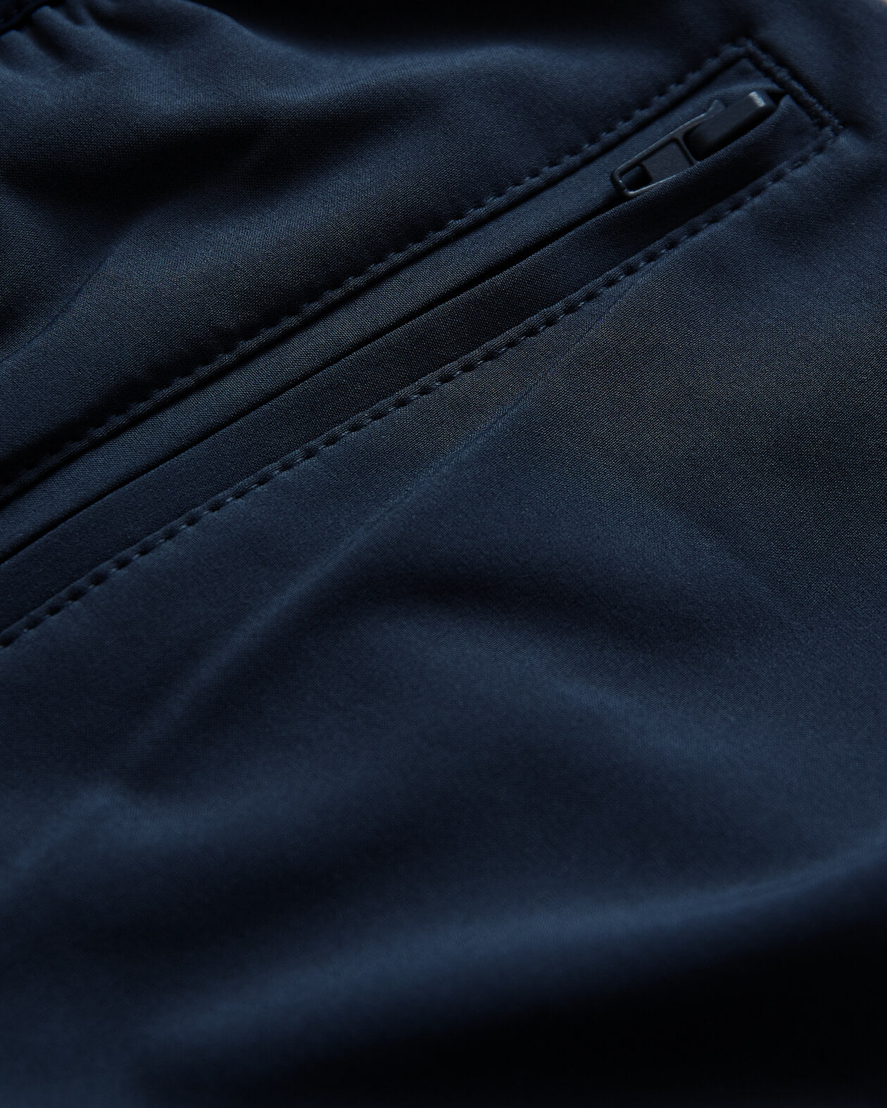 7 Navy Active Training Short with zippered pocket and detailed stitching.