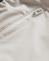 7 Sandstone Active Training Short's light-beige zippered pocket detail.