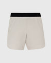 7 Sandstone Active Training Short with black waistband and side slit hem.