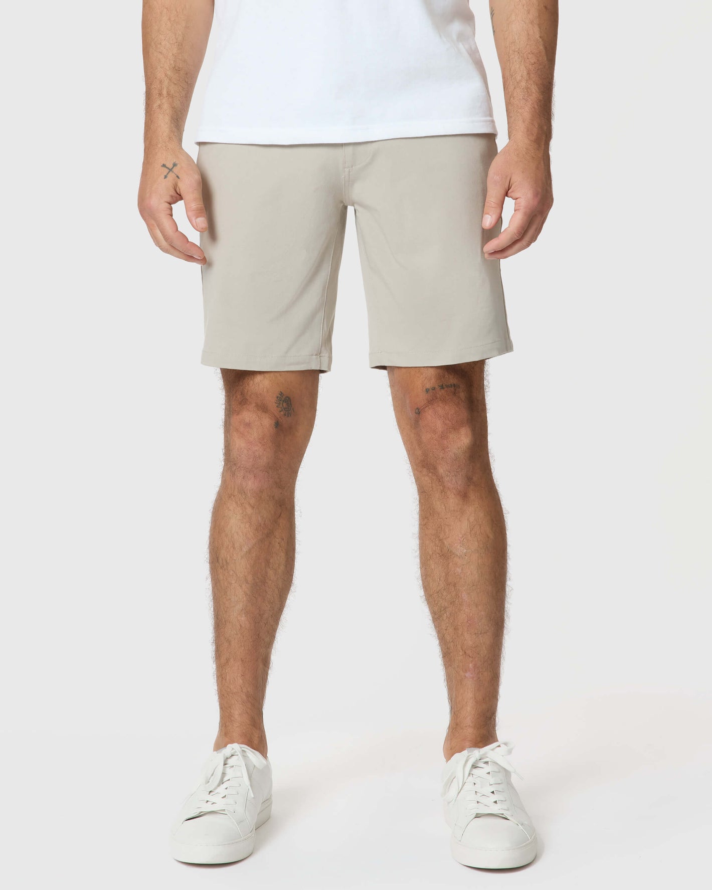 Man wearing Sandstone Twill Short with white sneakers.