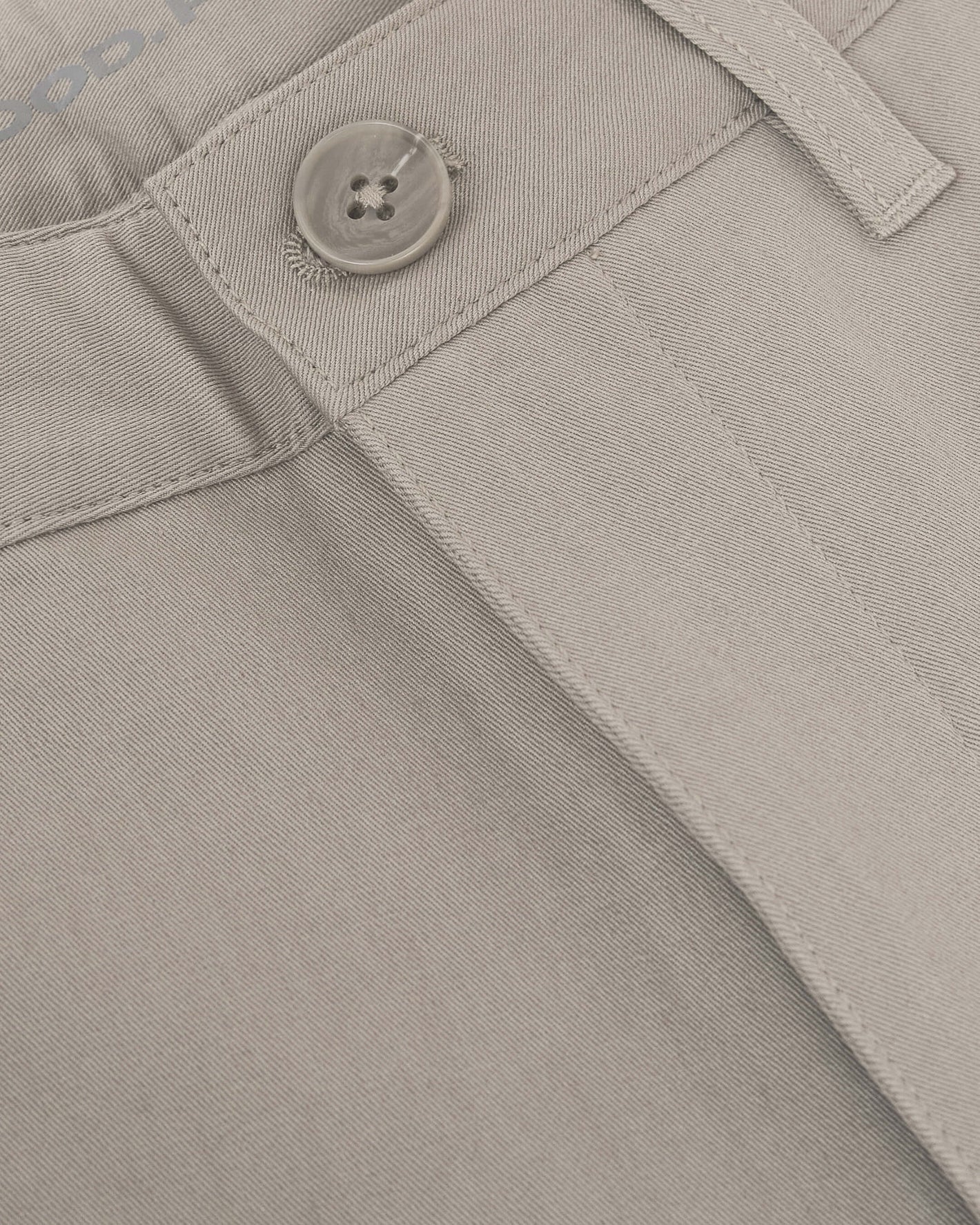 Sandstone Twill Short waistband with button, belt loop, and front-fly stitching.