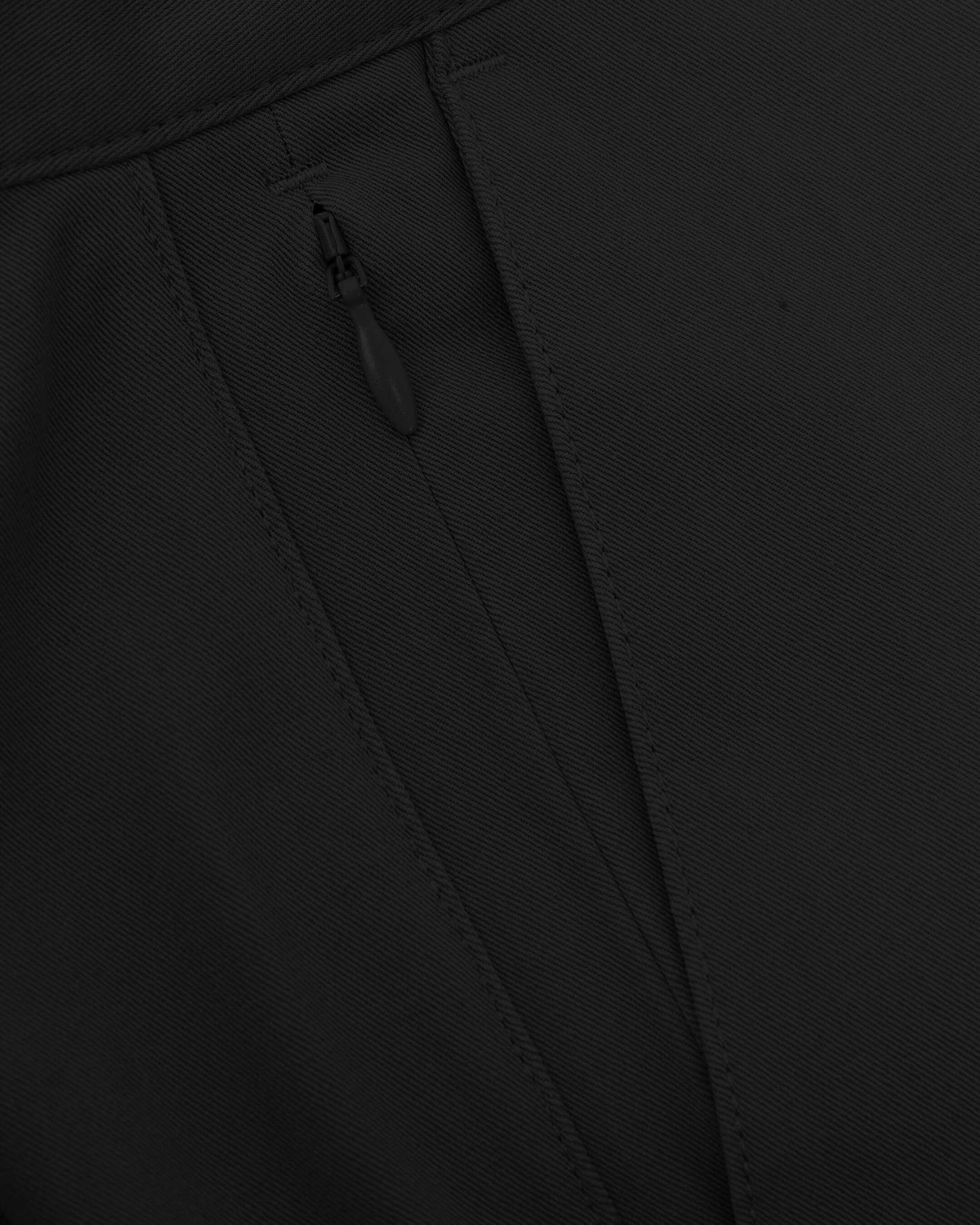 7 Black Classic Twill Shorts, close-up of seam and zippered pocket.