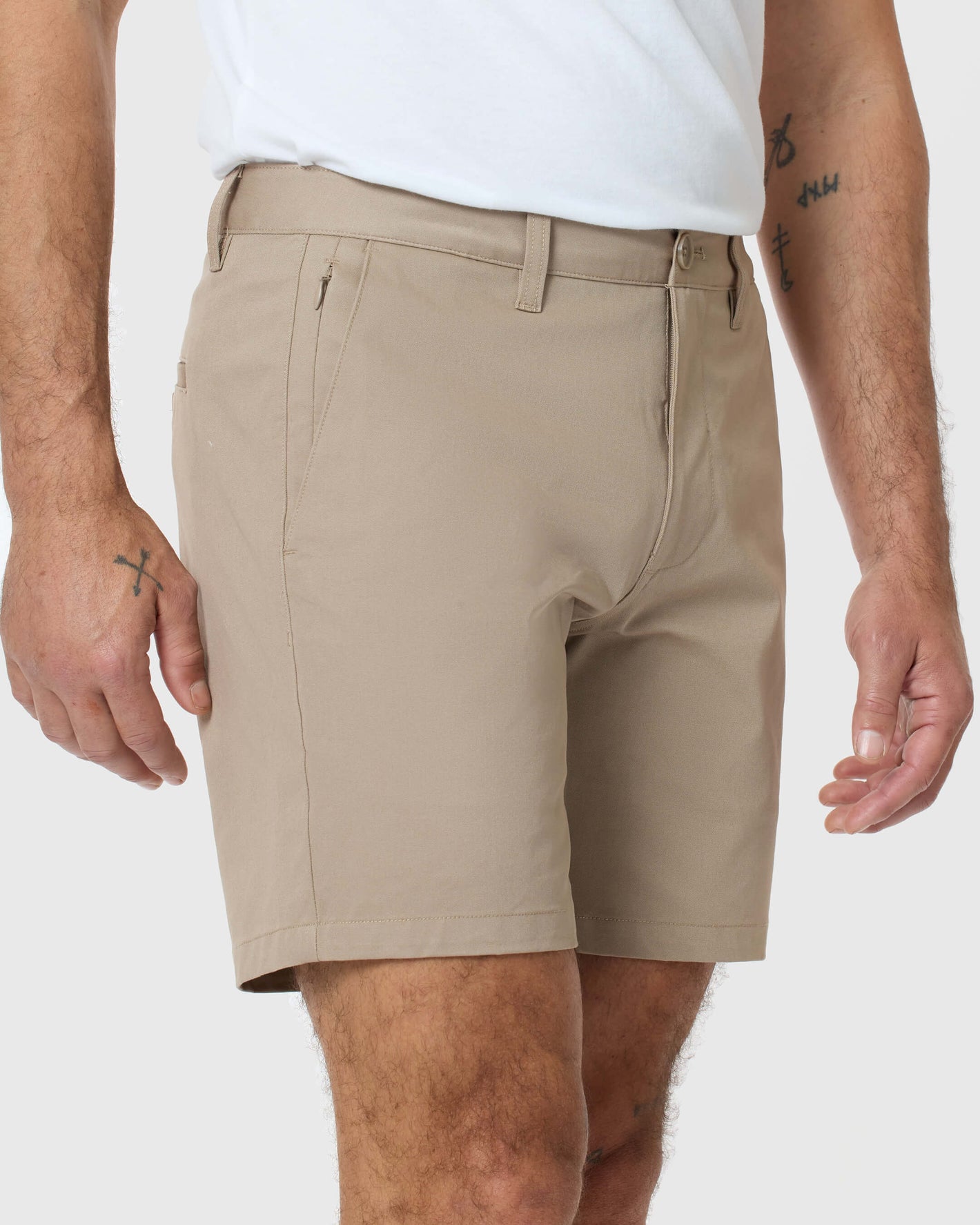 Man wearing 7 Khaki Classic Twill Shorts with side zipper pocket.
