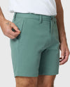 Person wearing 7 Moss Classic Twill Shorts with zippered pocket open.