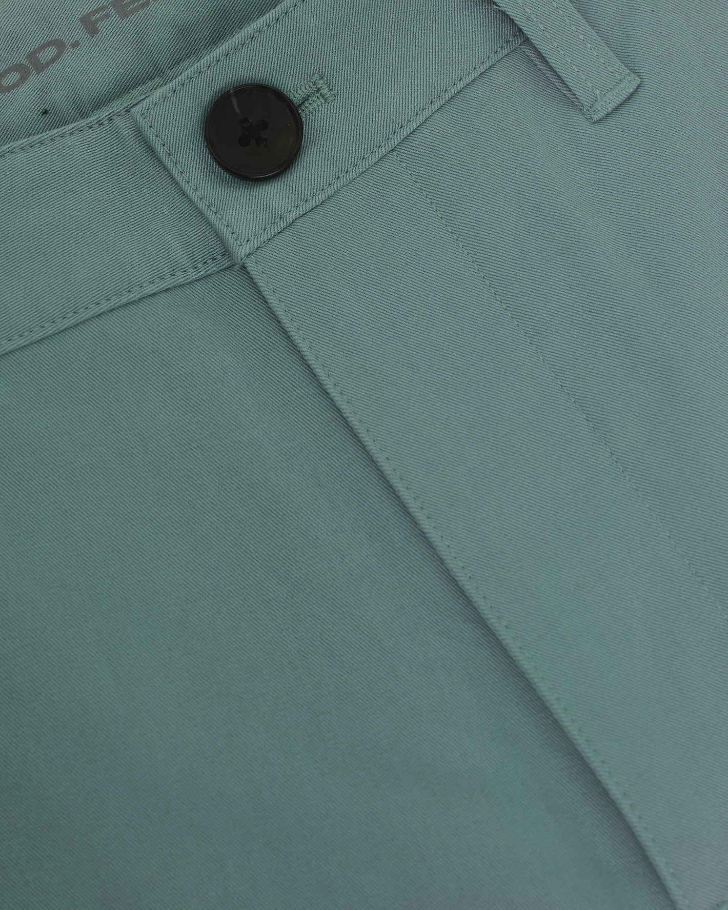 7 Moss Classic Twill Shorts waistband with button, belt loop, and fly.