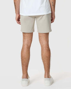 True Classic7 Sandstone Classic Twill Shorts in light-beige on back view model.