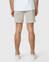 7 Sandstone Classic Twill Shorts in light-beige on back view model.