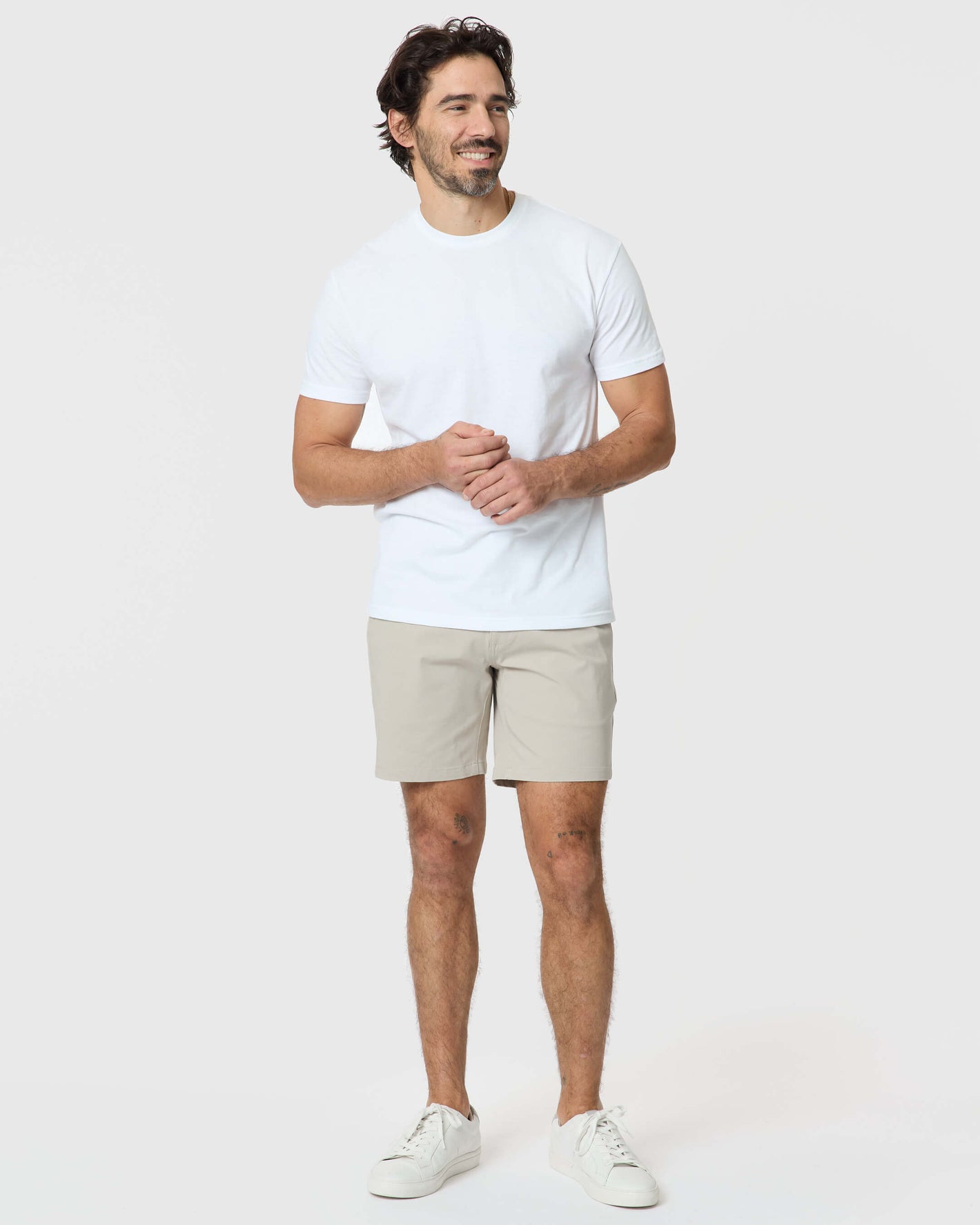 Man wearing 7 Sandstone Classic Twill Shorts, showcasing a relaxed, comfortable fit.