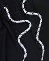 Black Swim Trunk with elastic waistband and white drawstring accents.