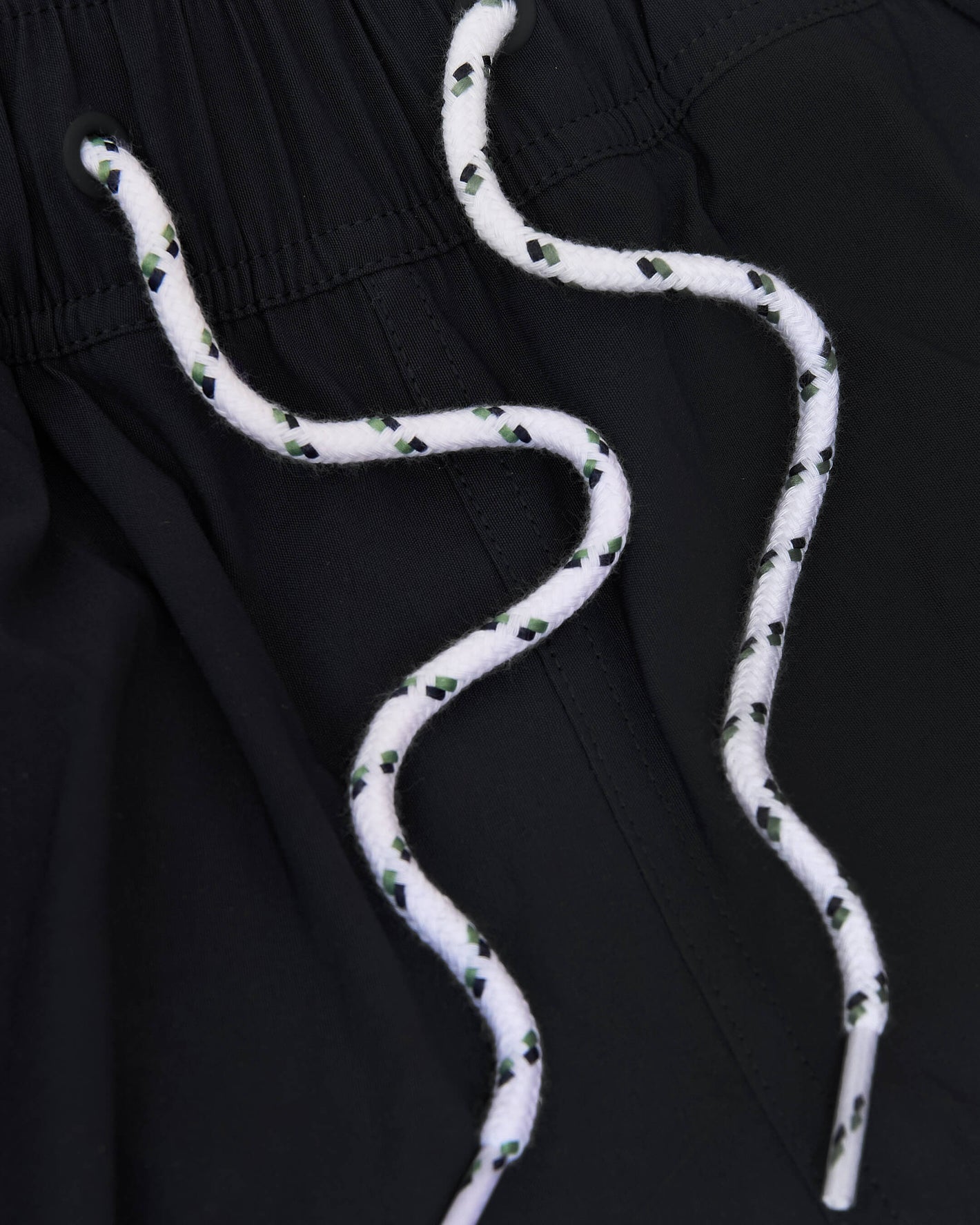 Black Swim Trunk with elastic waistband and white drawstring accents.