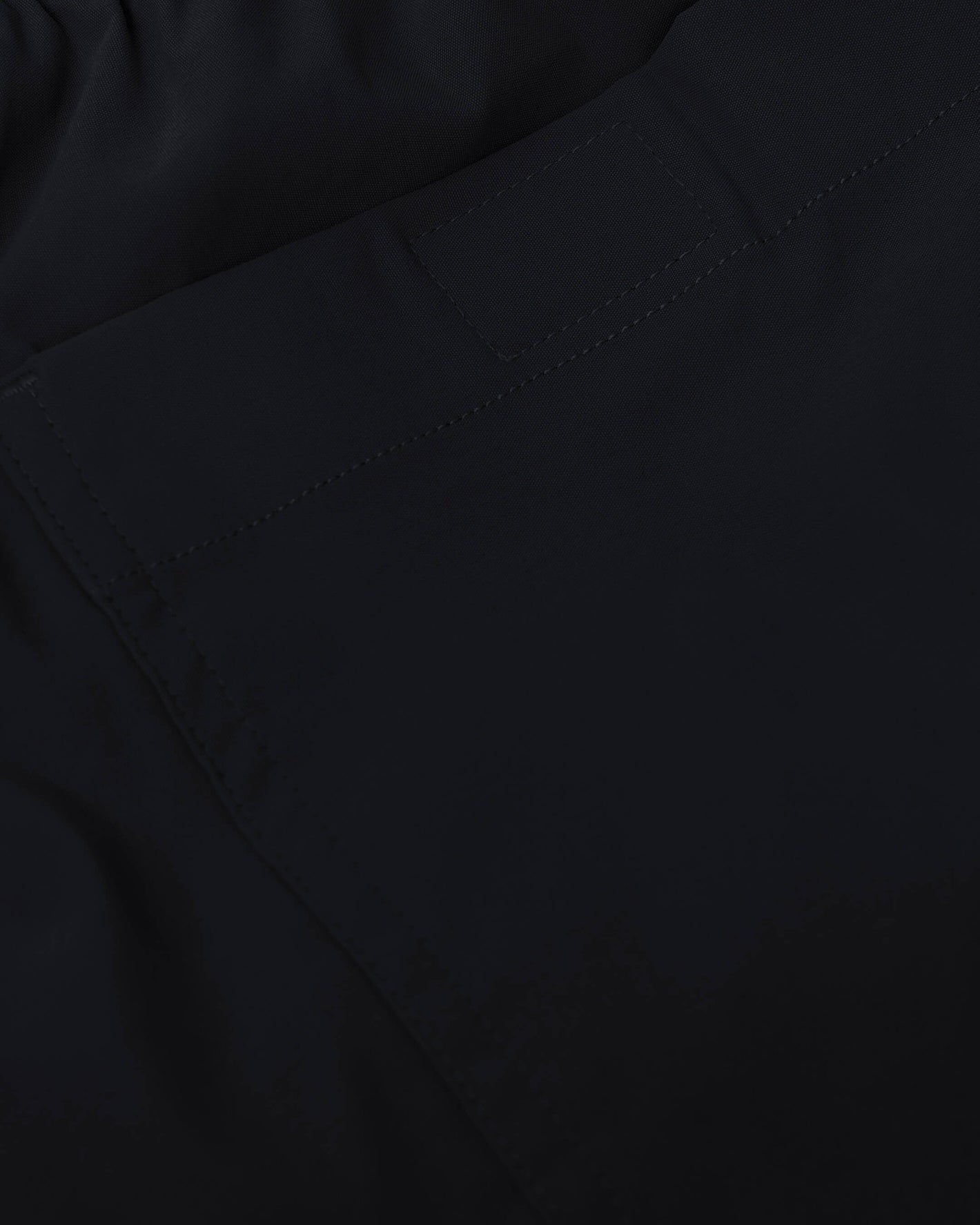 Black Swim Trunk waistband and rear pocket stitching detail.