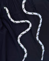 Navy Swim Trunk with elastic waistband and white drawcords.