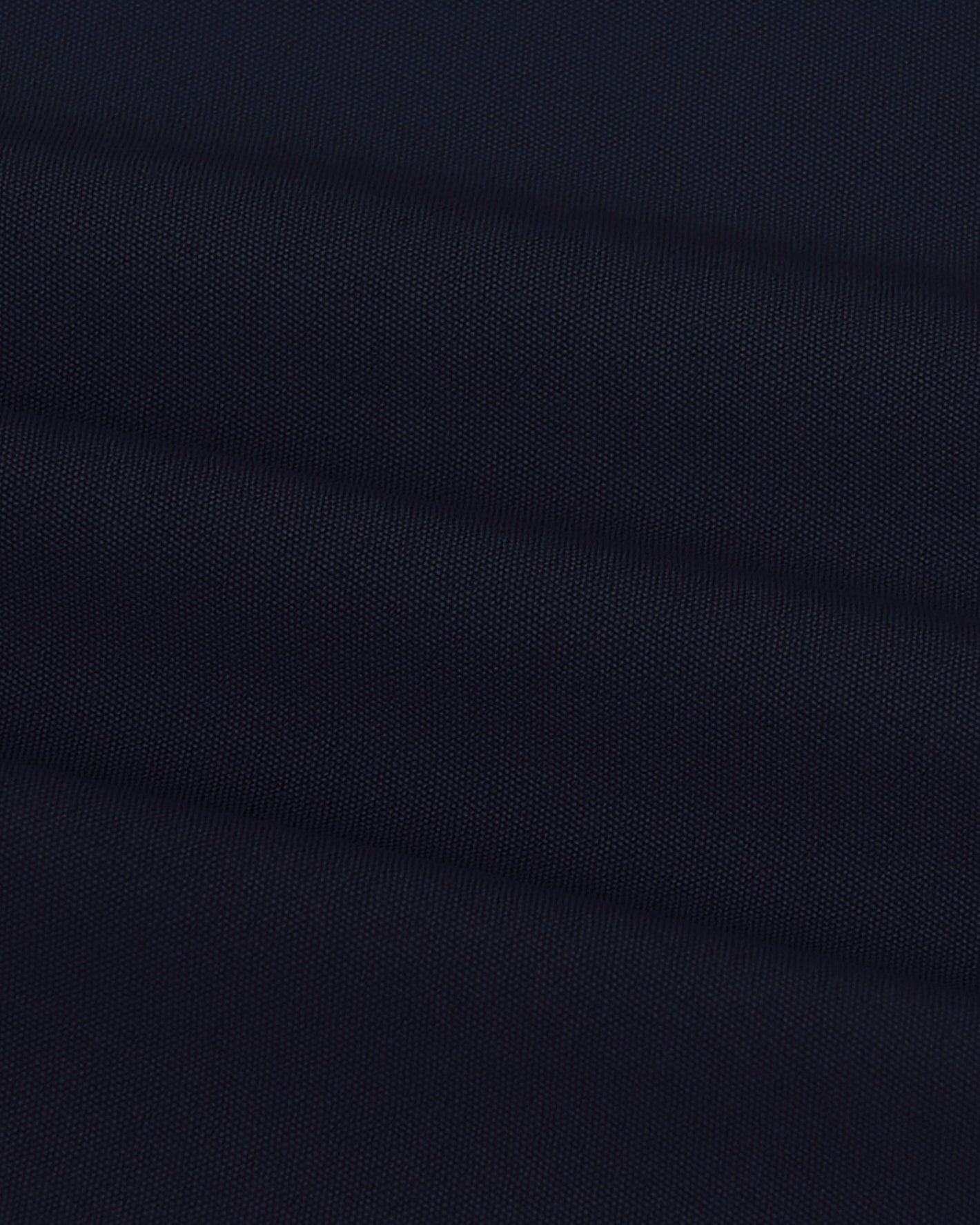 Navy Swim Trunk fabric with gentle diagonal folds.