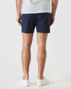 Navy Swim Trunk with elastic waist, visible tattoos on legs.