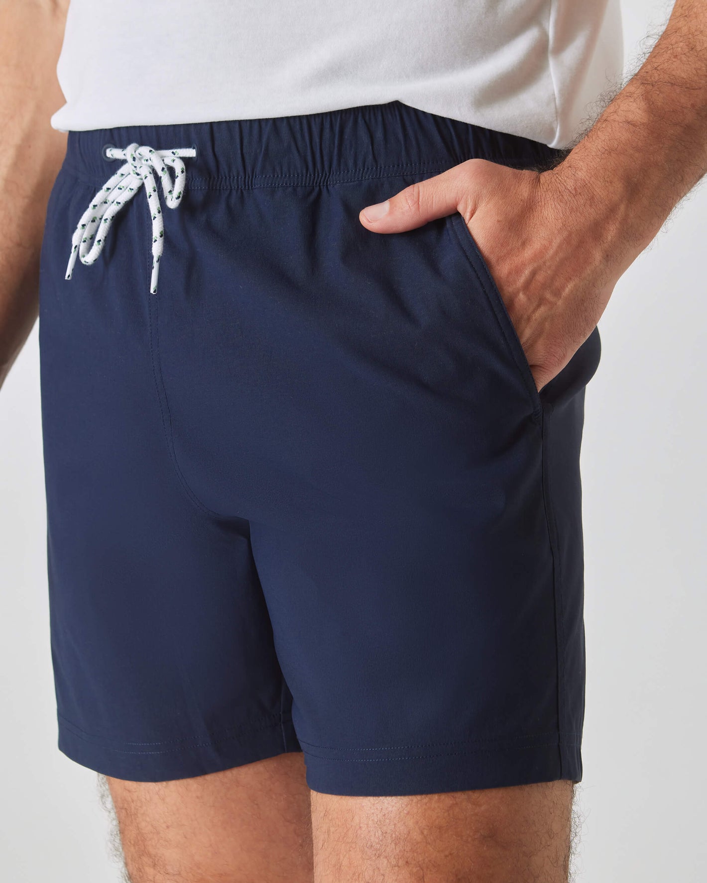 Navy Swim Trunk with elastic waist and white drawcord.