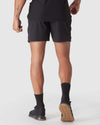 Black & Carbon 7 2-In-1 Active Training Shorts worn with black socks and shoes.