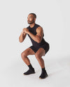 Man squatting in Black 2 In 1 Training Short.
