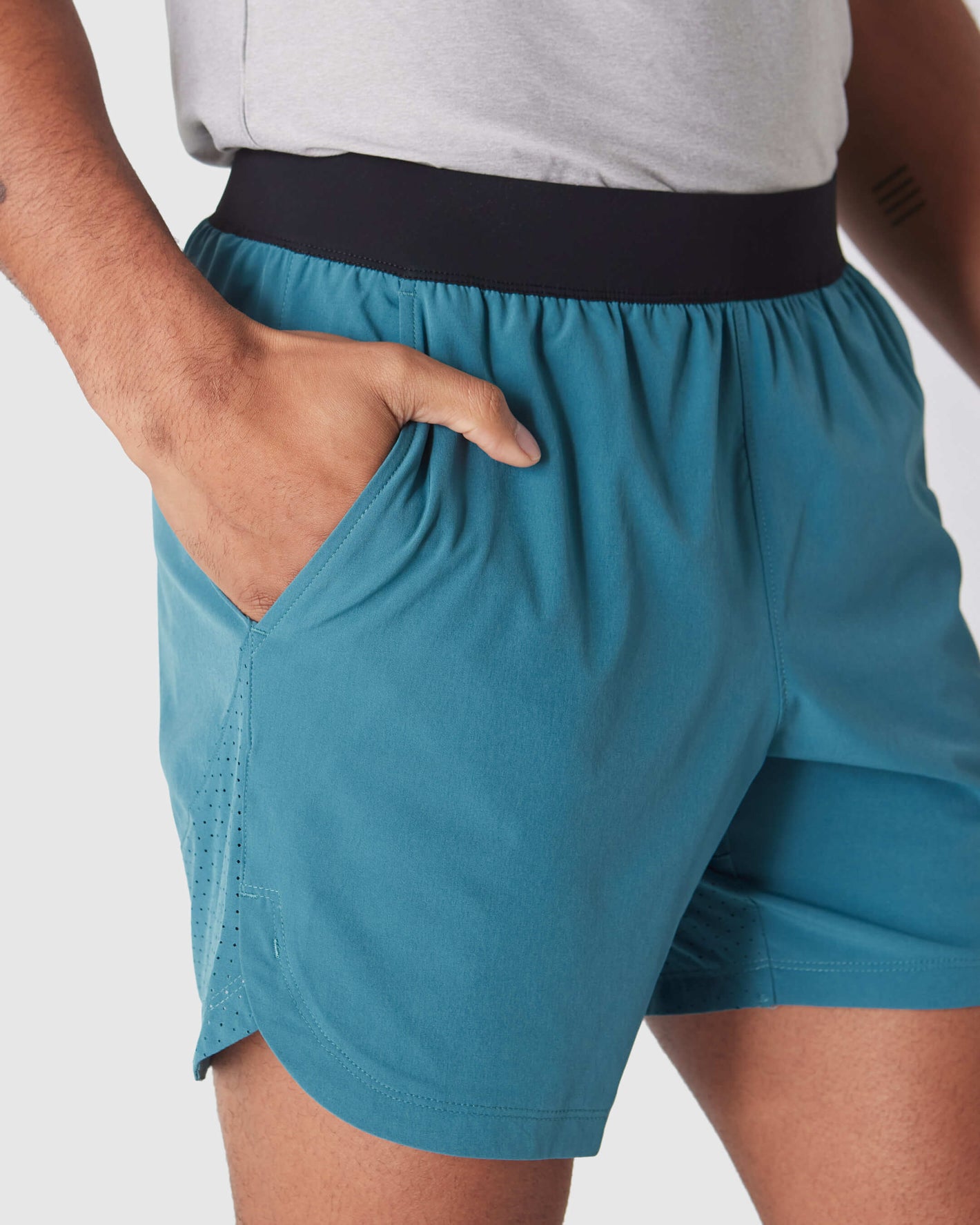 Sapphire 7 Active Training Short with teal color, black waistband, pocket.
