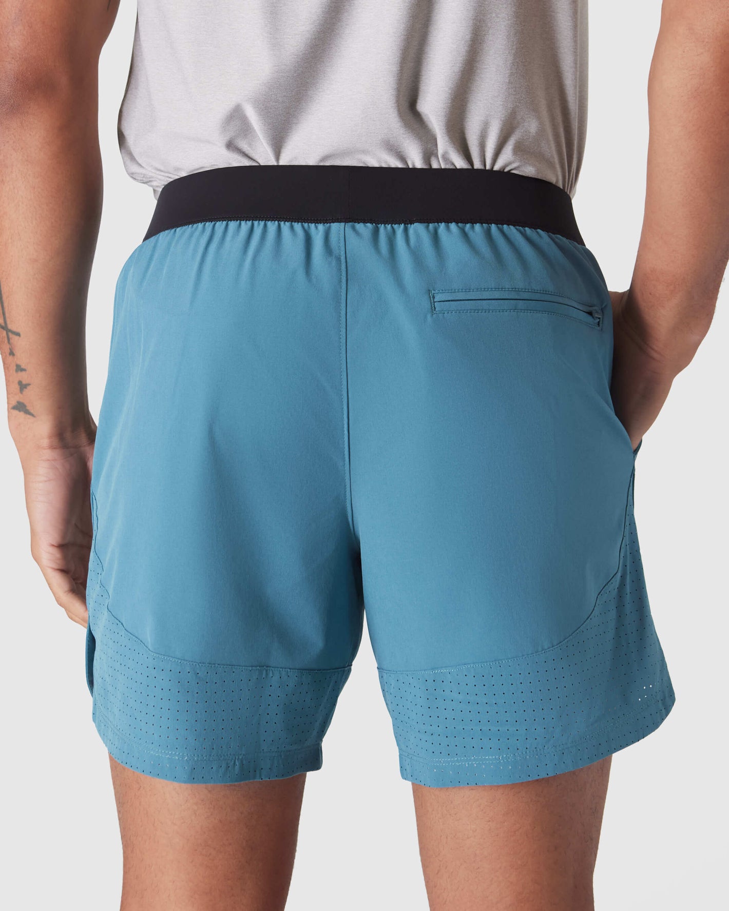 Sapphire 7 Active Training Short with zippered pocket and perforated hem.