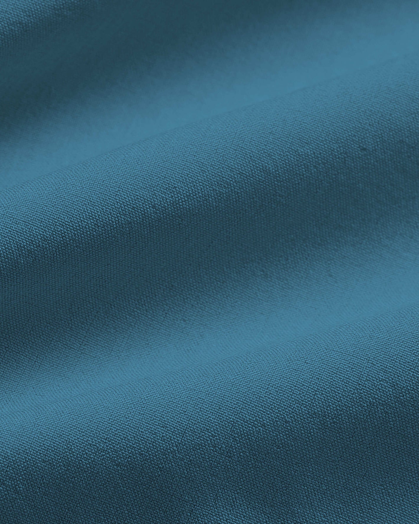 Sapphire 7 Active Training Short's teal-blue woven fabric close-up.