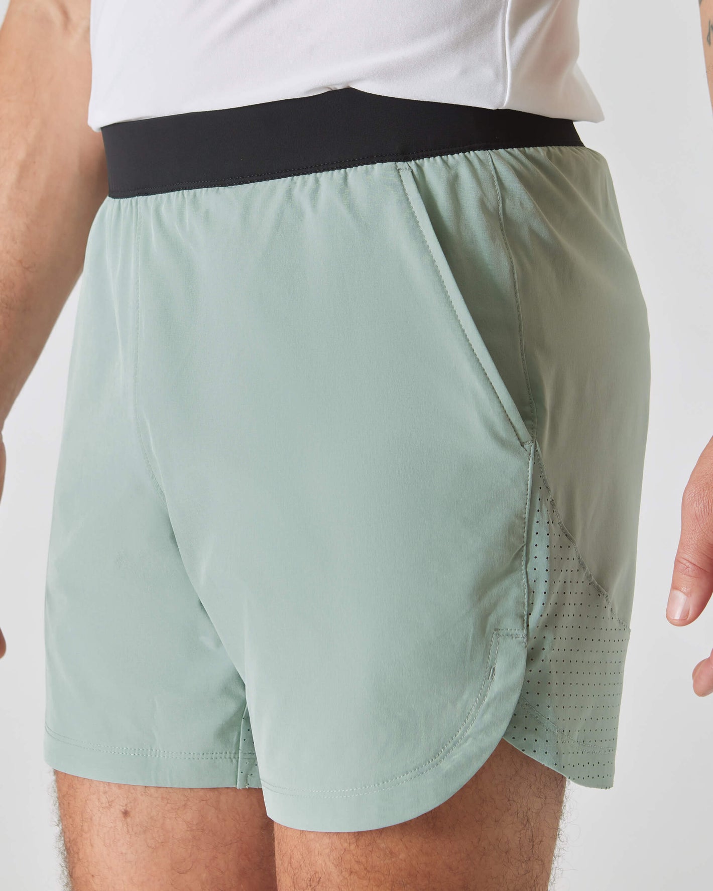 7 Slate Green Active Training Shorts 2.0 with black waistband, perforated hem.
