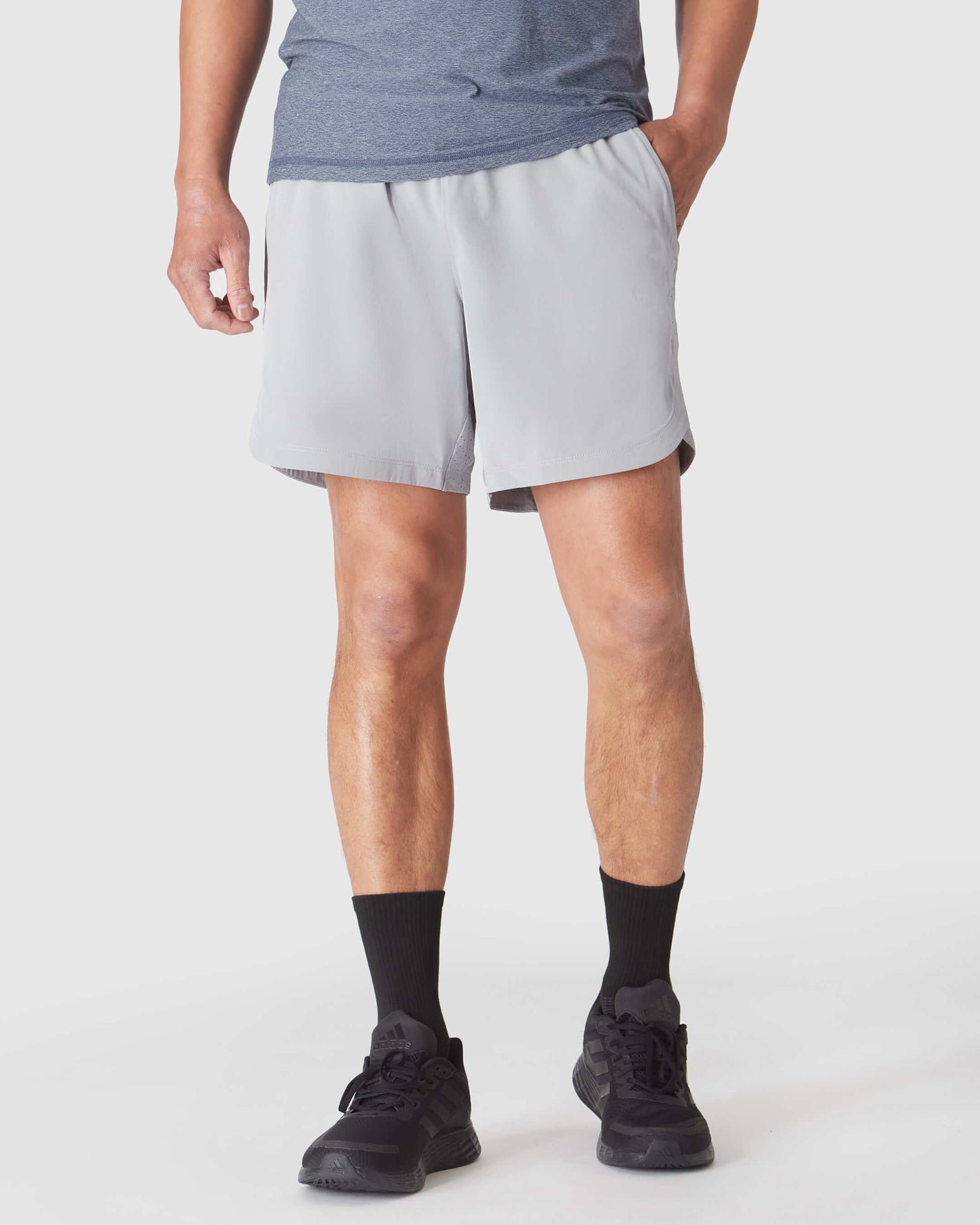 Man wearing Steel 7 Active Training Short with zippered pockets.