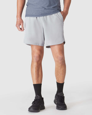 Man wearing Steel 7 Active Training Short with zippered pockets.