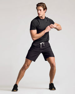 True ClassicMan posing in 9 All Black Active Quick Dry Shorts.