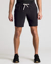 Man wearing 9 Black & Carbon Active Quick Dry Shorts, standing shoulder-width apart.