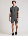 Man wearing Carbon 9 Active Quick Dry Shorts, showcasing athletic fit.