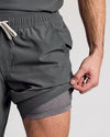 Man wearing 9 All Carbon Active Quick Dry Shorts, revealing inner liner.