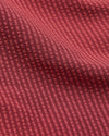 5 Cardinal Seersucker Swim Trunks with textured, ribbed red fabric pattern.