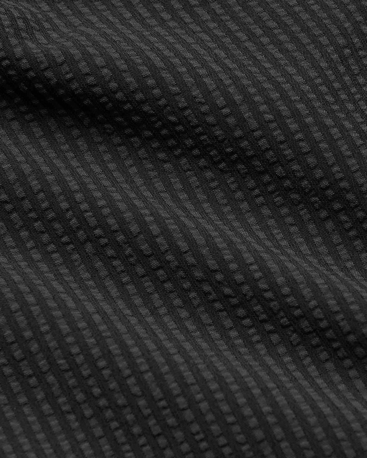 5 Smoke Seersucker Swim Trunks with textured ribbed pattern and quick-dry fabric.