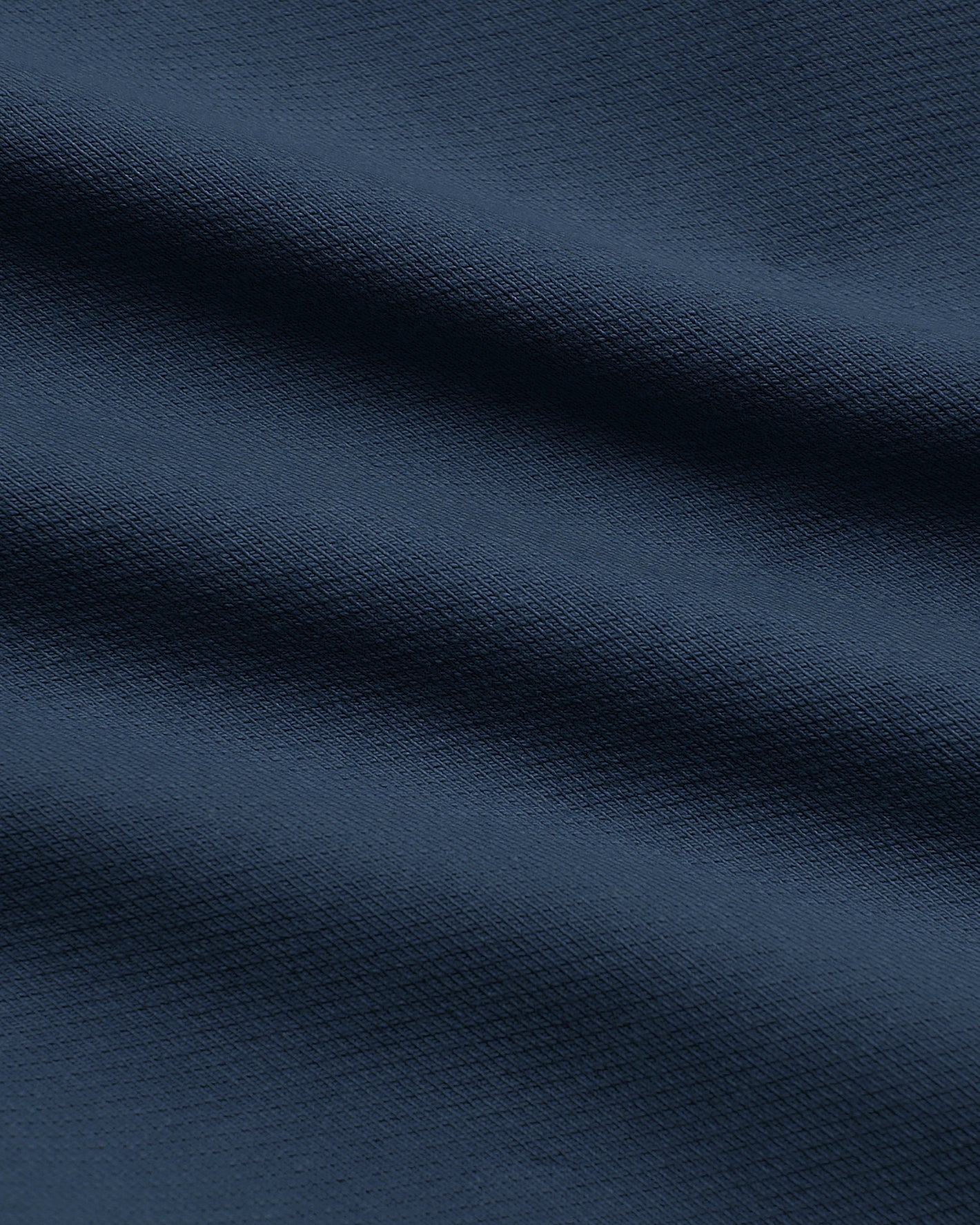 9 Navy Classic Chino Shorts 2.0, close-up of textured fabric folds.