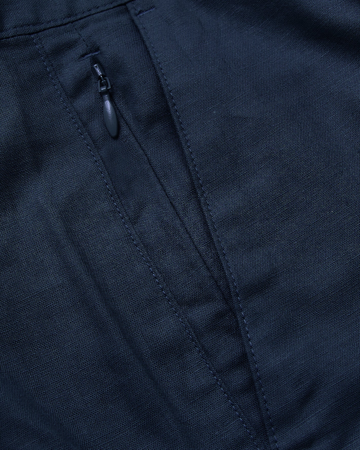 9 Navy Linen Shorts with seam detail and hidden zippered pocket.