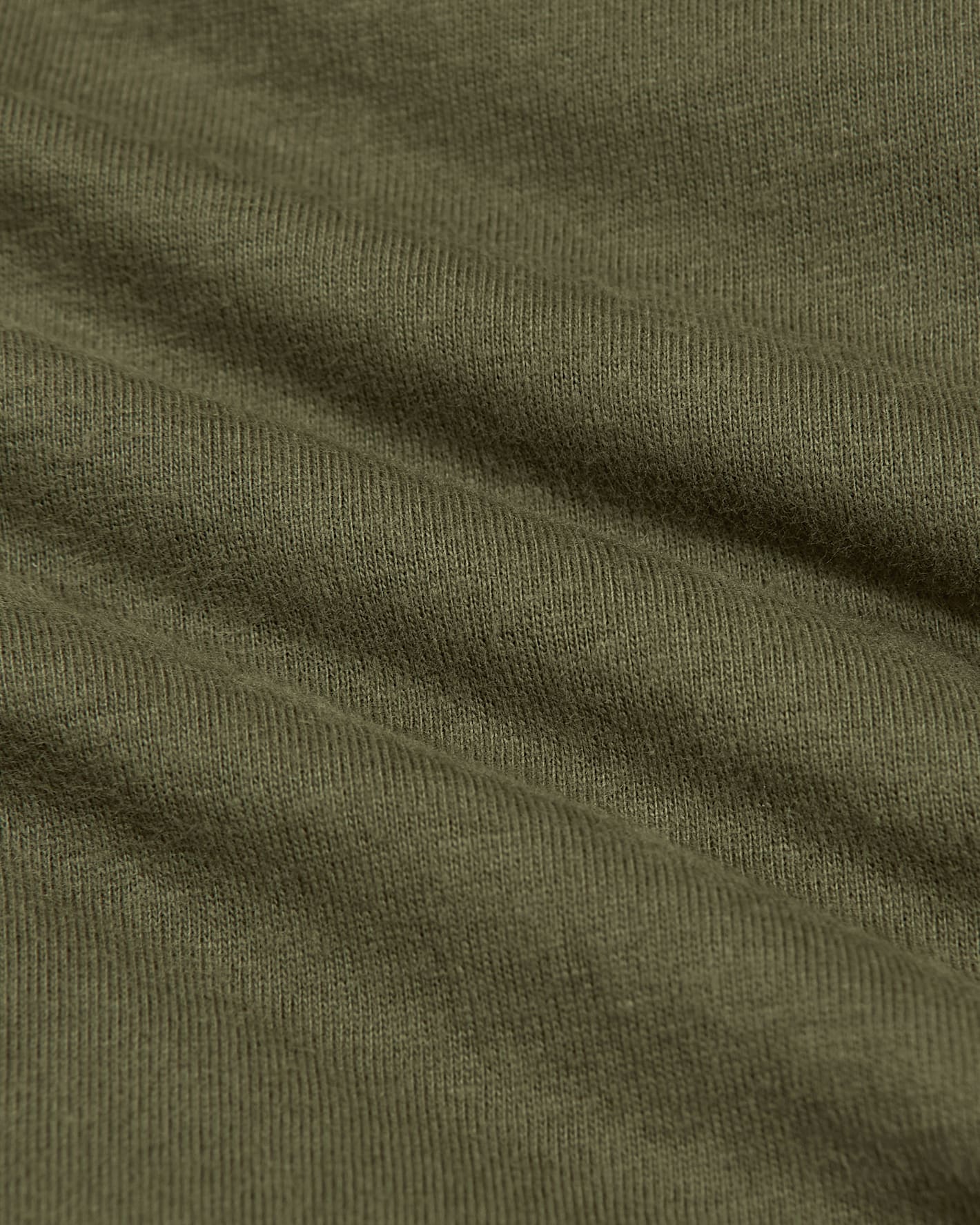 Close-up of olive green fabric texture