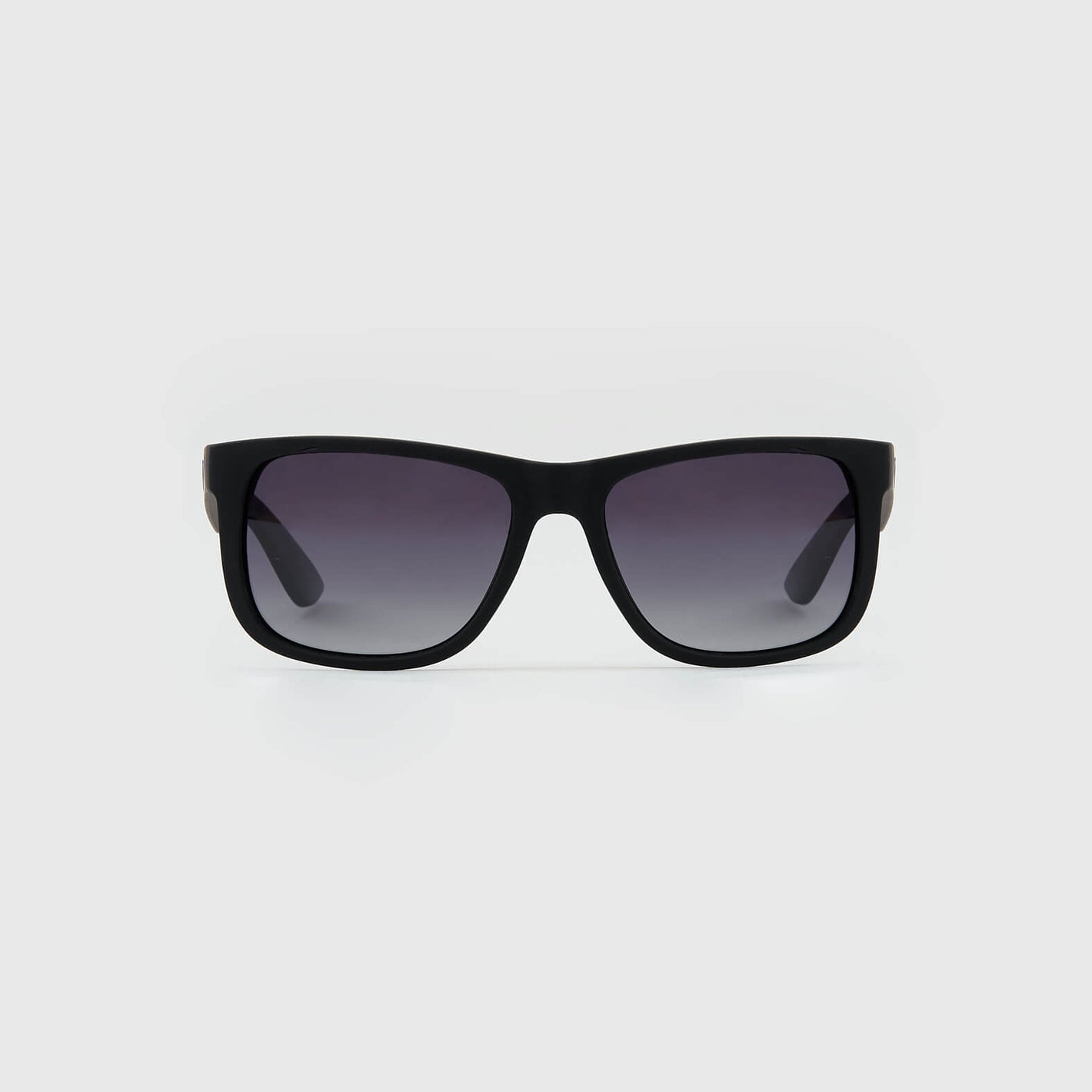 Copy Of Classic Polarized Sunglasses with rectangular frames on a light background.