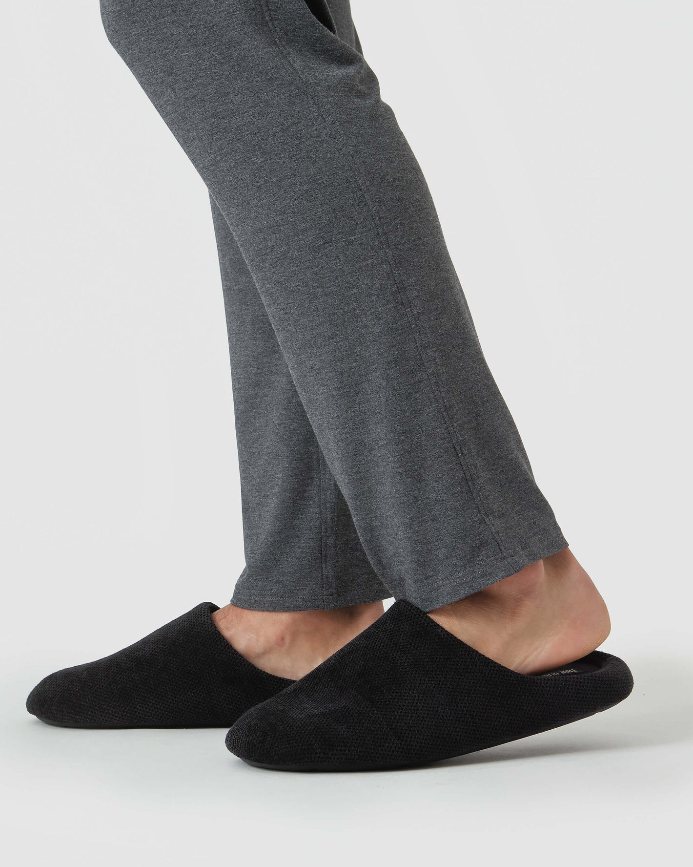 Black Slippers: slip-on, closed-toe design with slide-free rubber soles.