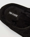 Black Slippers with knit-and-fleece headband, TRUE CLASSIC label visible.