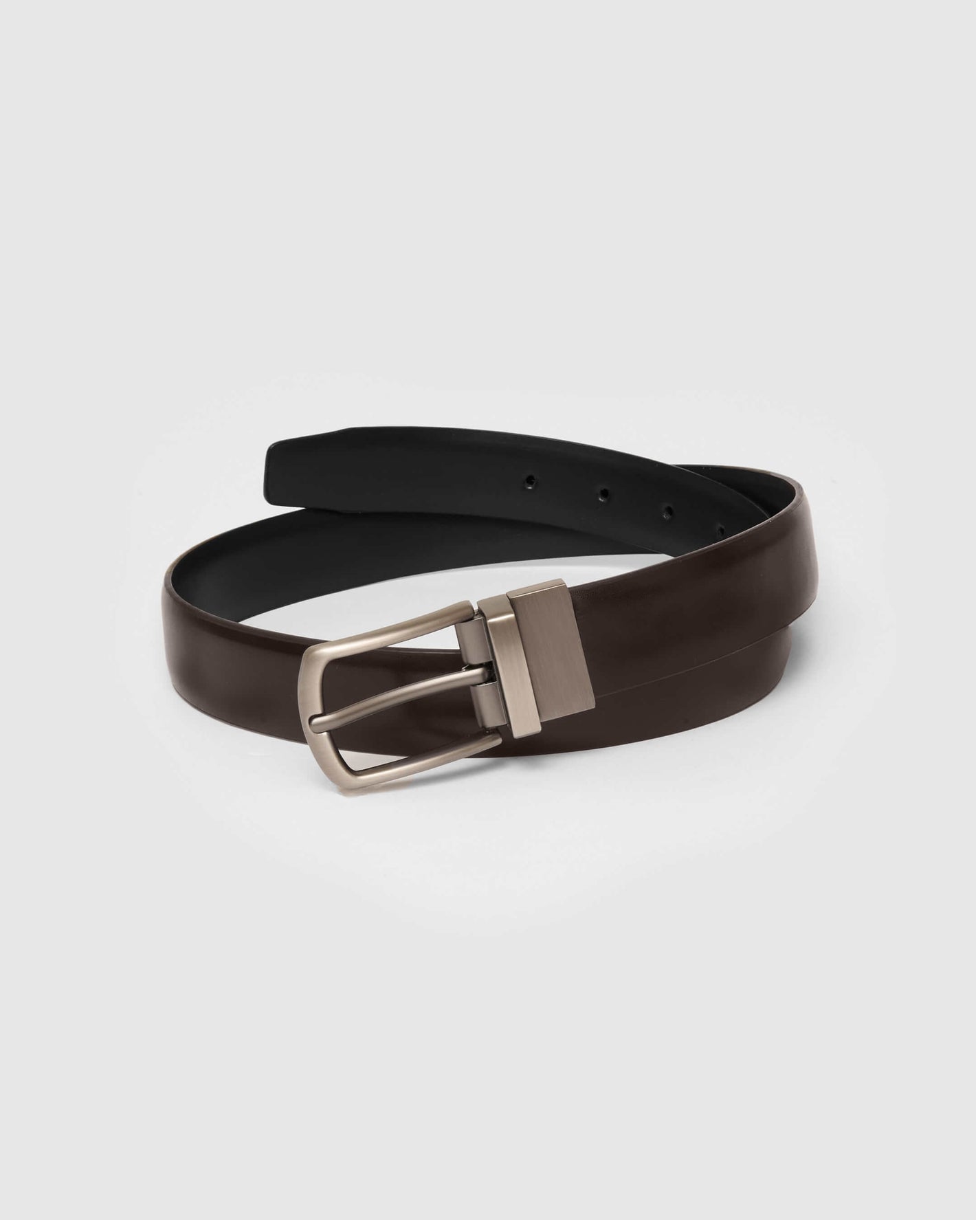Reversible Dress Belt with silver buckle, two-toned faux leather.